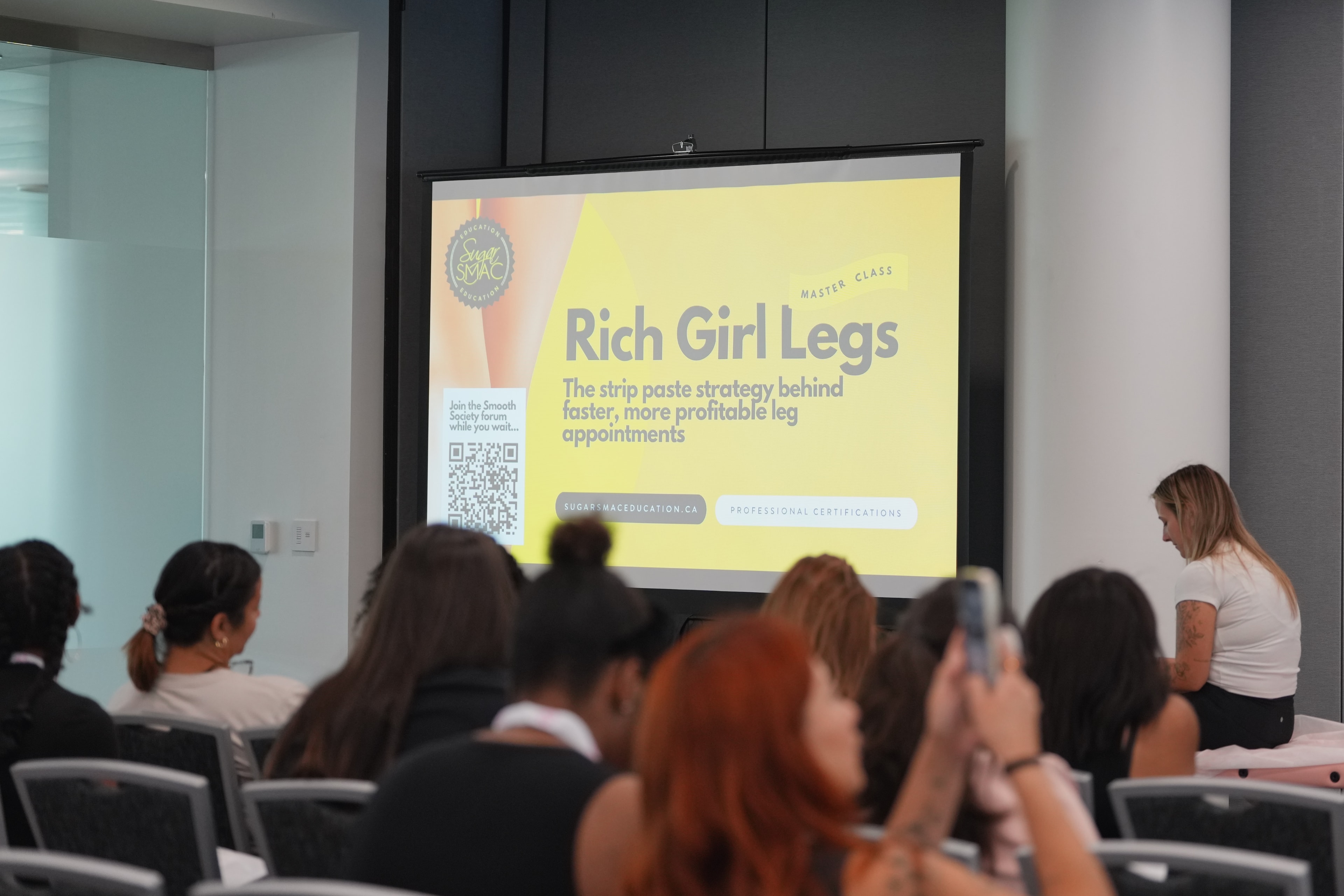Sugar SMAC educator presenting a masterclass on advanced sugaring technique